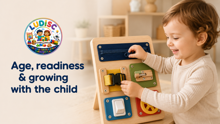 Toddler hands using large, securely attached busy-board activities suited to an age-appropriate challenge.